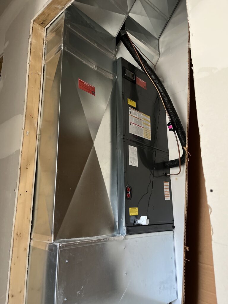 New air handler and sheet-metal ductwork installed in a utility closet in Louisville, KY