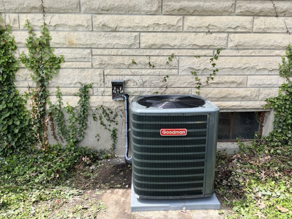 New Goodman air conditioner installed beside a limestone home in Louisville, KY