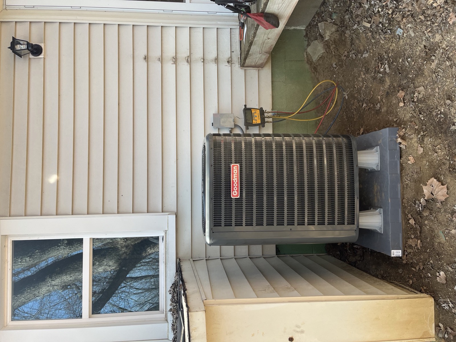 Litsey technician checking system pressures with gauges during a maintenance visit in Louisville, KY
