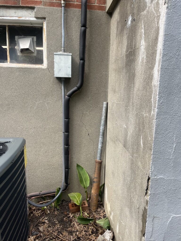 Insulated refrigerant line set and electrical whip run to an air conditioner in Louisville, KY