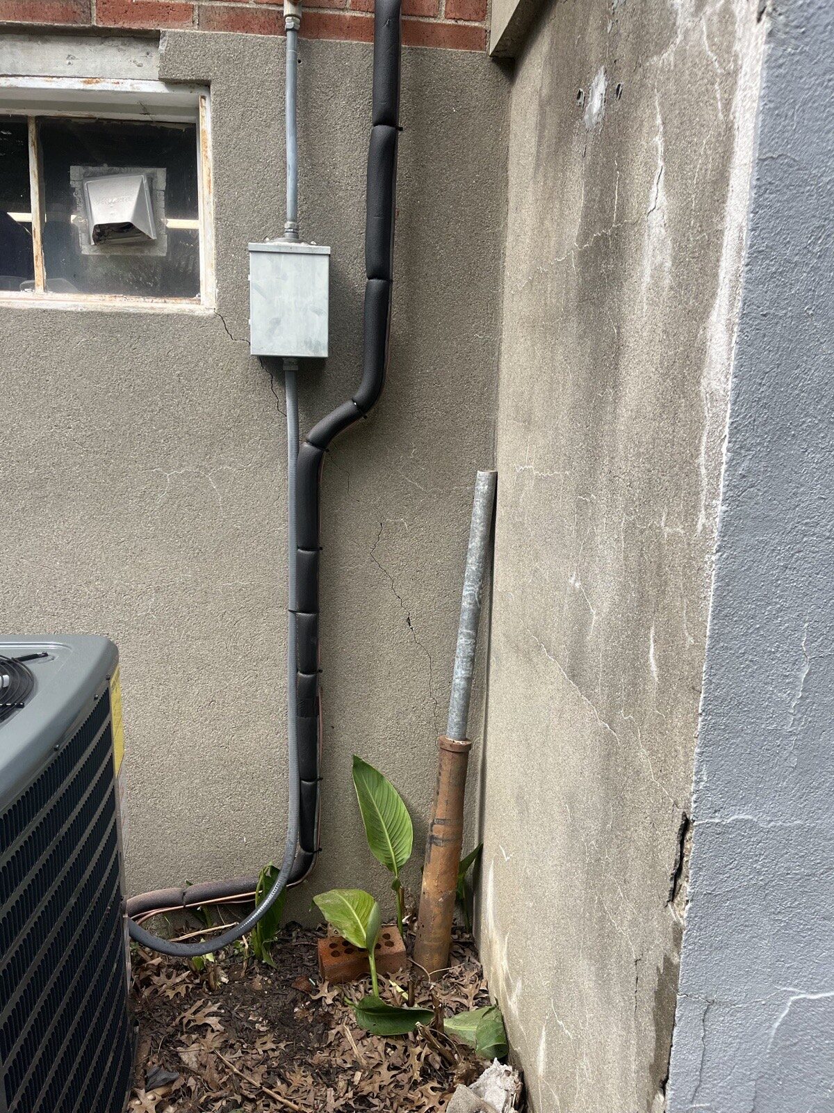 Insulated refrigerant line set and electrical whip run to an air conditioner in Louisville, KY