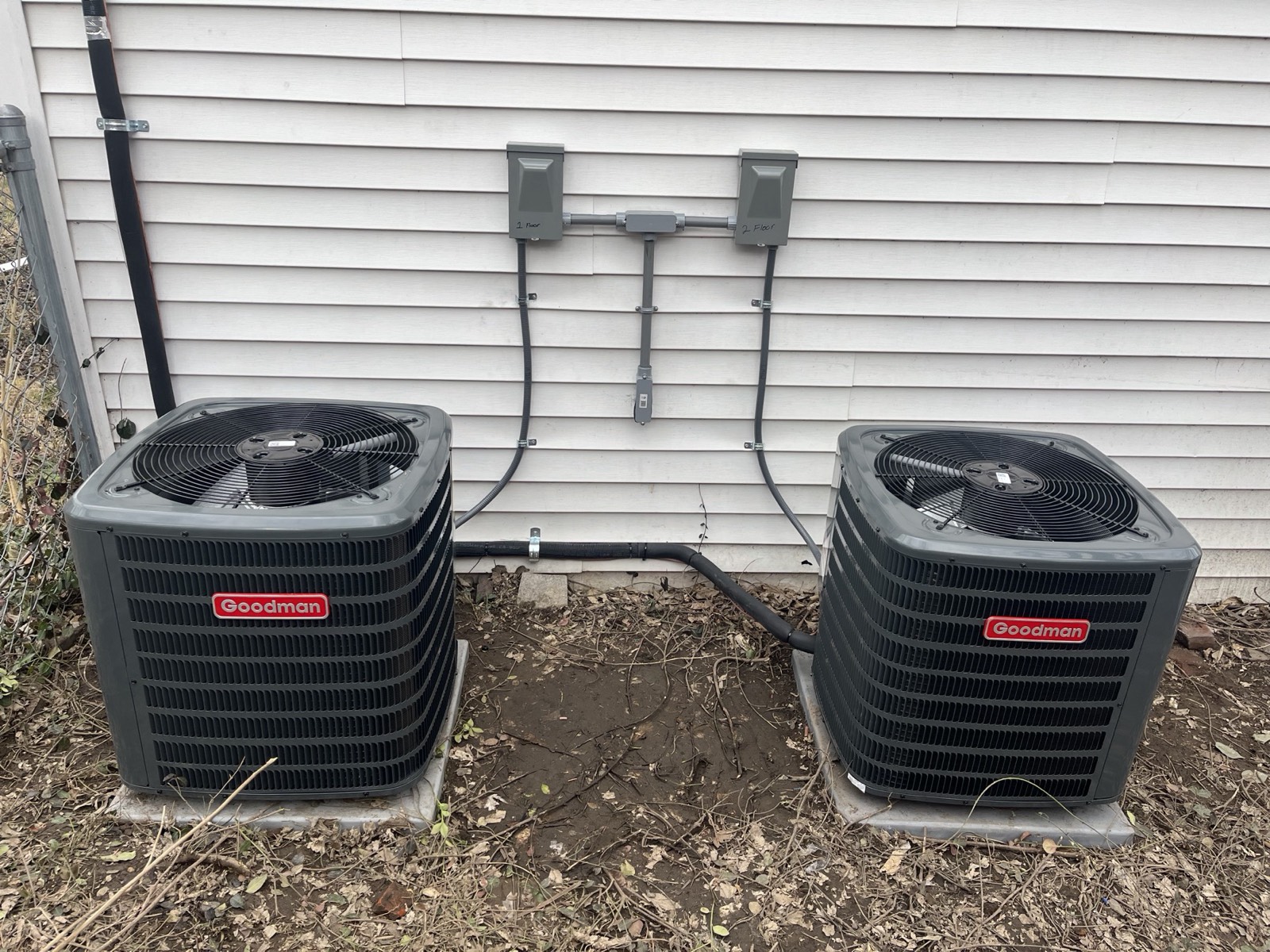 Two Goodman air conditioners serving the first and second floors of a Louisville, KY home